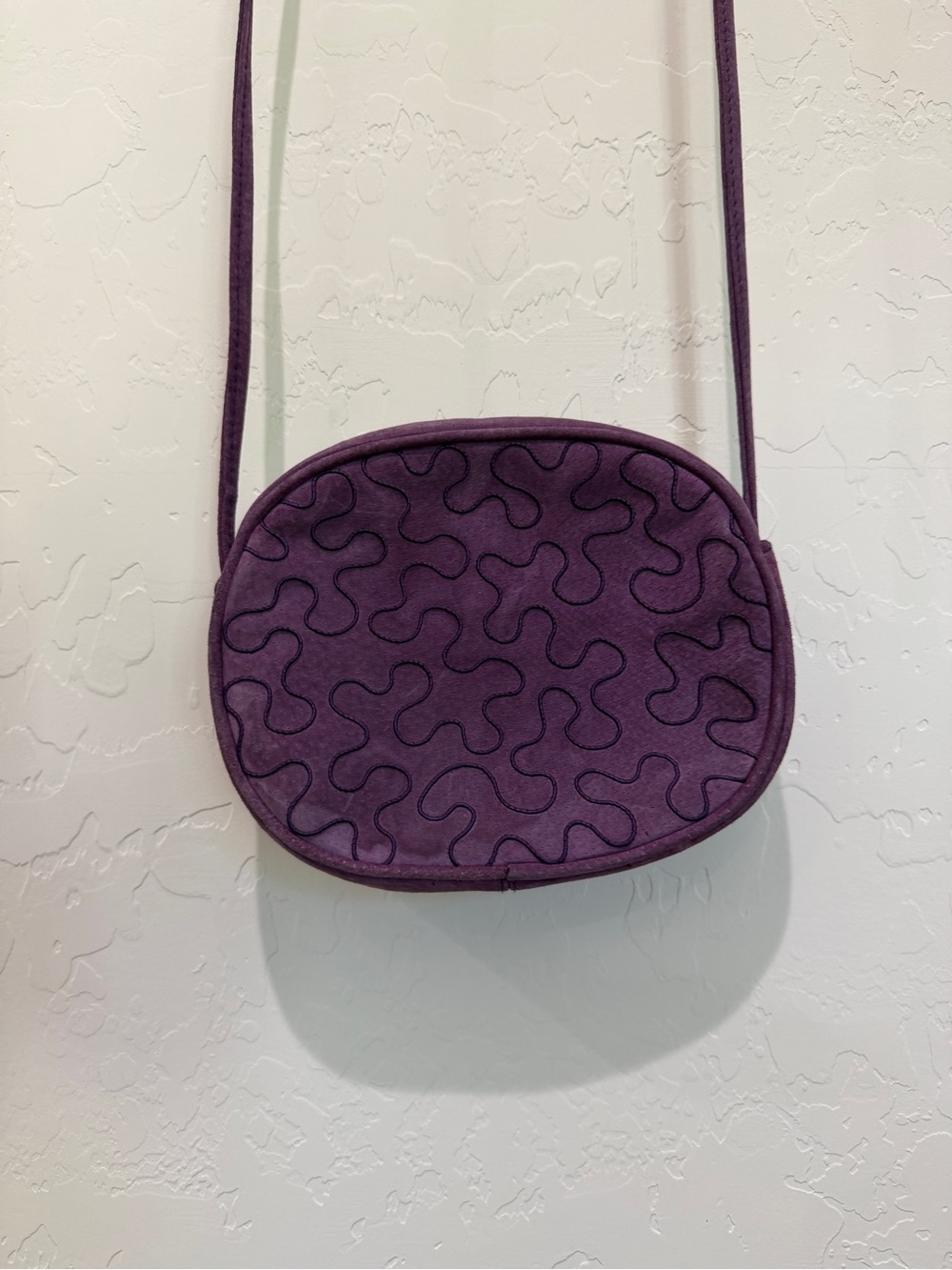 Plum Quilted Oval Crossbody Bag with Adjustable Strap